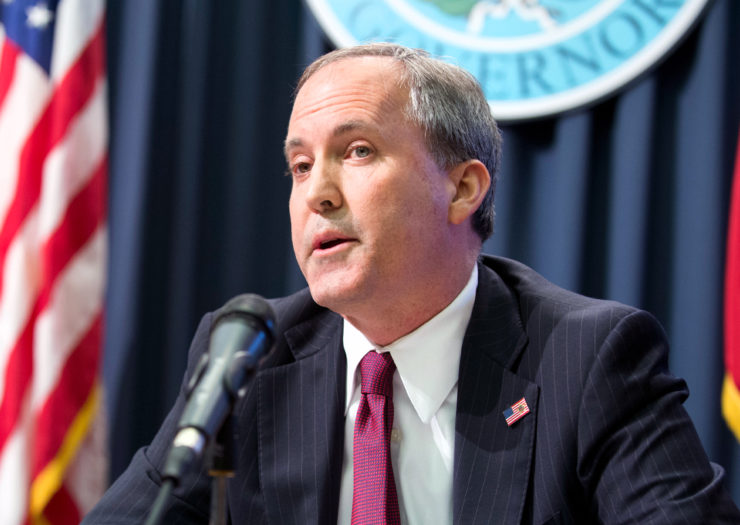[Photo: Texas Attorney General Ken Paxton speaks during a press conference.]