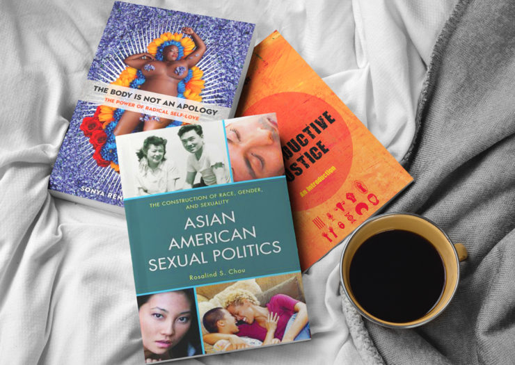 [Photo: Three books laid out atop each other on a bed comforter. Next to them is a mug of coffee.]