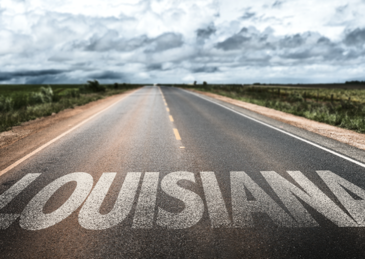[Image of Louisiana written along an empty road]