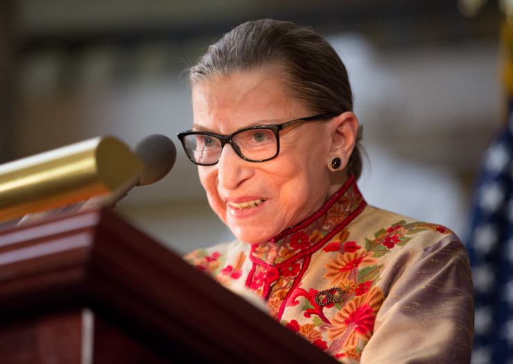 [PHOTO: Ruth Bader Ginsburg speaks at a political event.]