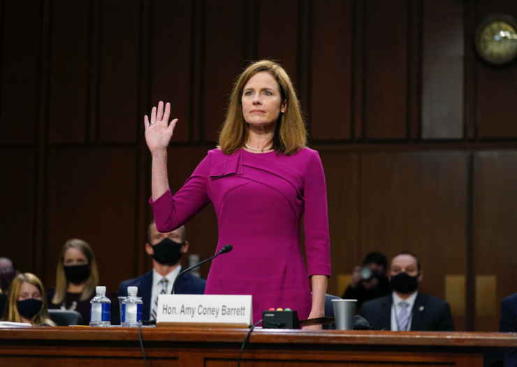 [PHOTO: Amy Coney Barrett raises her right hand and sworn in during her confirmation hearing]