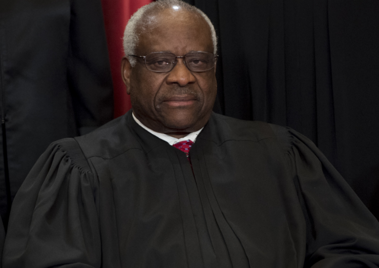 [PHOTO: Clarence Thomas posing for group Supreme Court photo]