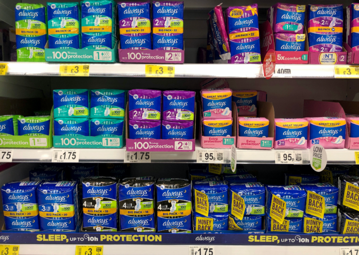 [PHOTO: Three rows of boxed tampons at the grocery store aisle]