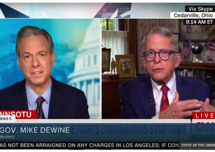 [Photo: A still shot of a video interview. On the left is CNN journalist Jake Tapper who is interviewing Gov. Mike DeWine to the right.]