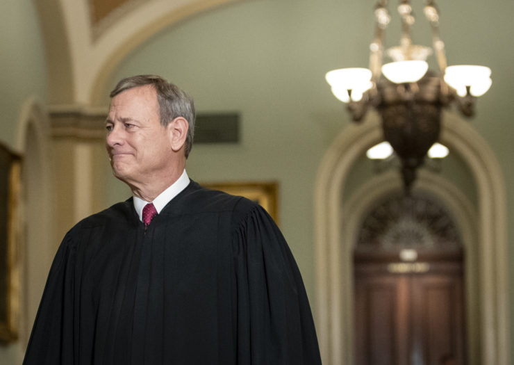 Photo of Chief Justice John Roberts in black robe and facing his right