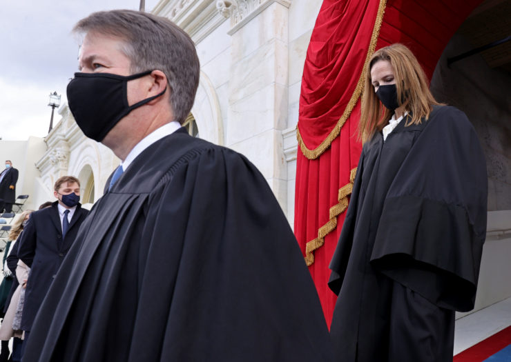 Photo of Brett Kavanaugh and Amy Coney Barrett wearing black masks and robes