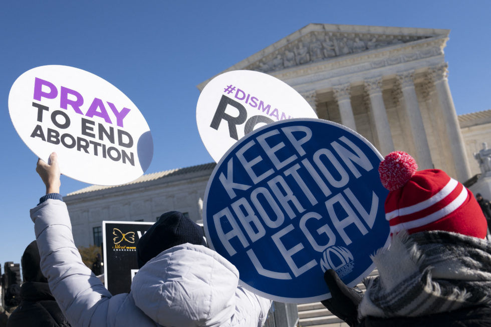 Photo of pro-choice and anti-choice demonstrators in front of the Supreme Court