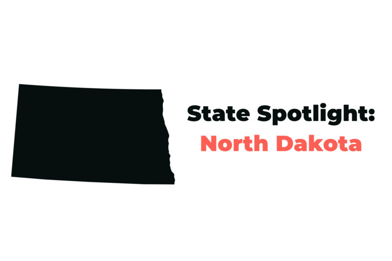 Map of North Dakota colored black against a white background, with the text
