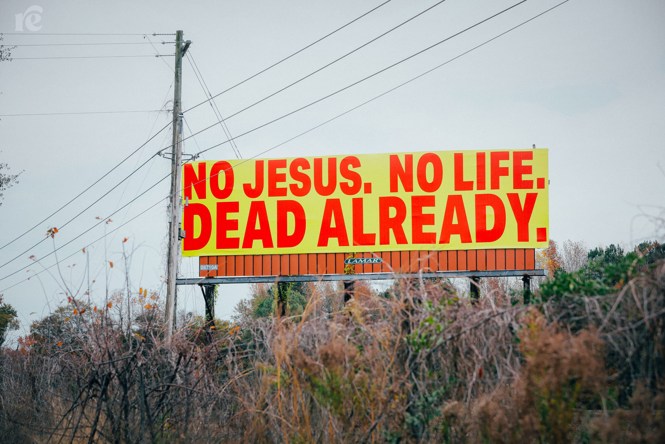 Yellow billboard that reads No Jesus, no Life. Dead already.