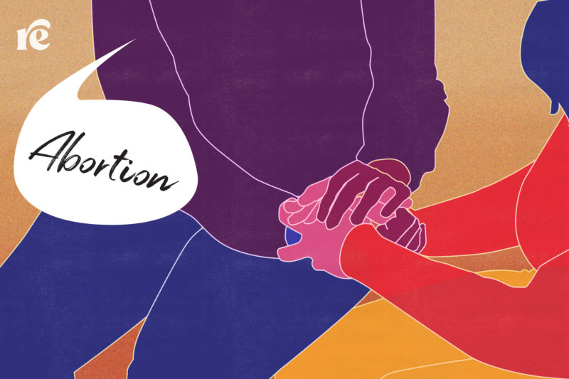 Illustration of two people supporting each other with their hands on top of the other's with a speech bubble that says abortion