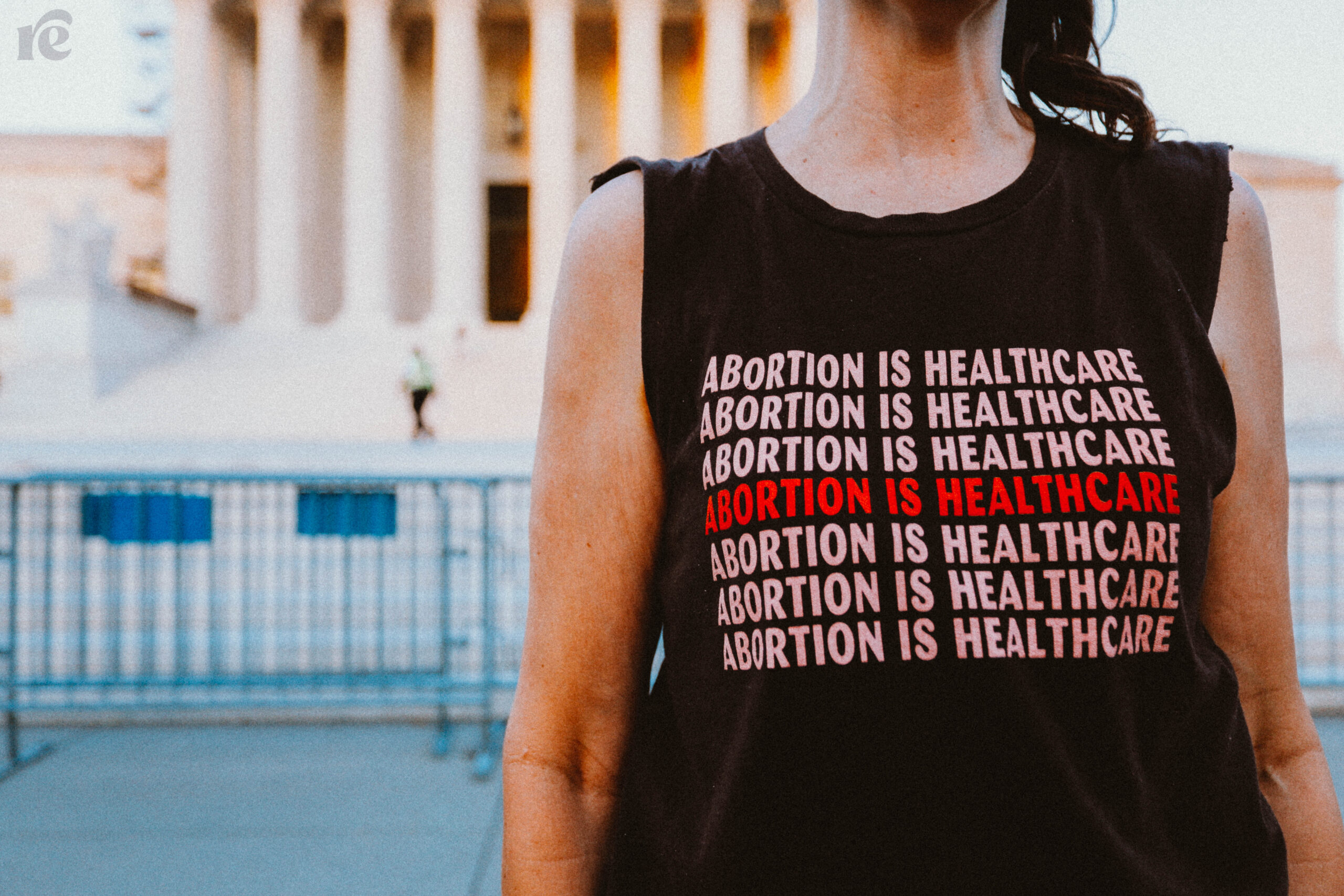 Photo of abortion rights supporter wearing a shirt that says Abortion is Healthcare