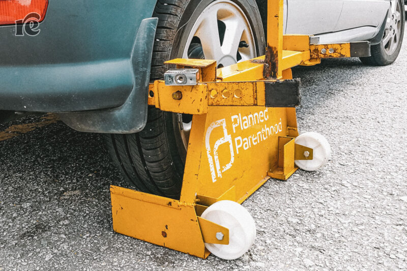 Photo illustration of a car boot with the Planned Parenthood logo