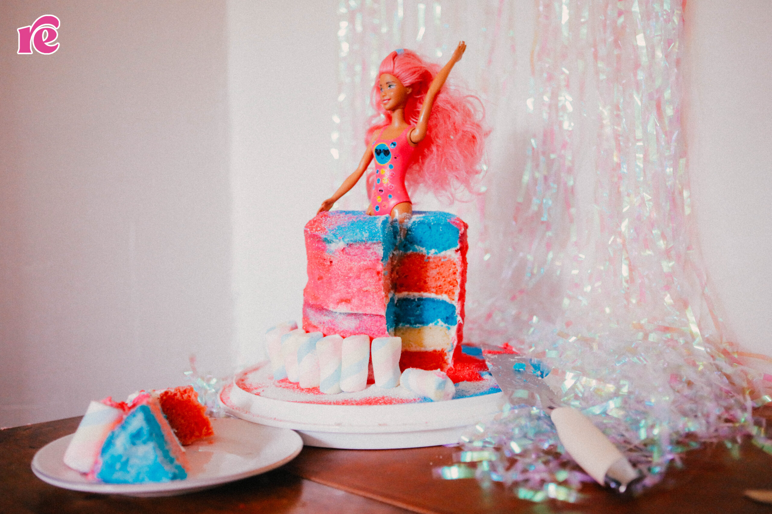 Barbie coming out a cake