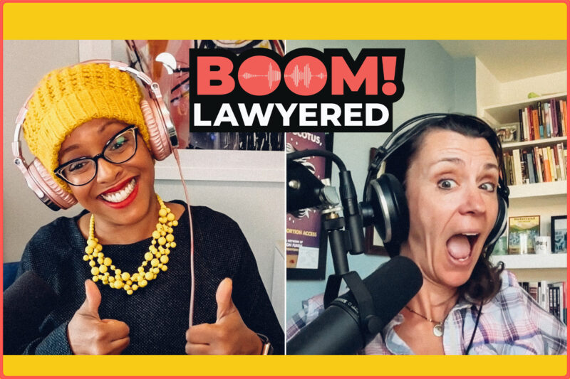Black woman and white woman behind microphones for podcast