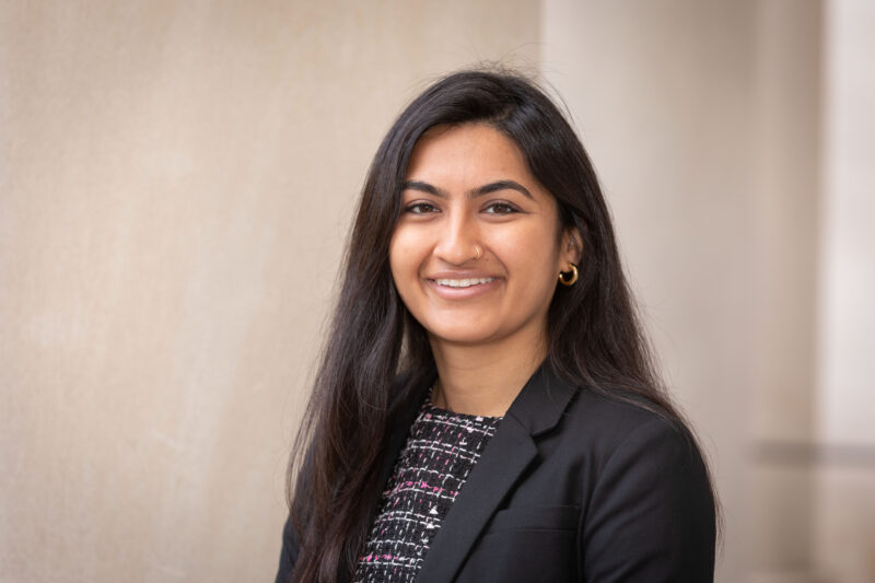 Light brown skin woman with long dark hair
