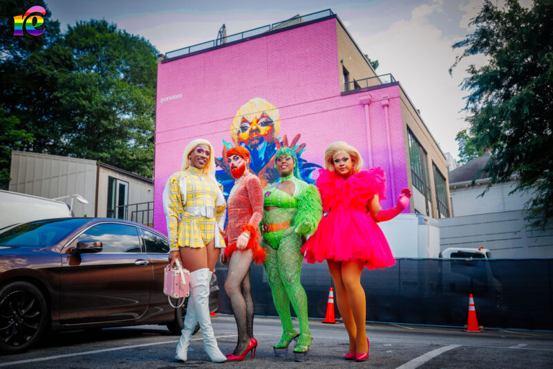 Drag queens standing in parking lot
