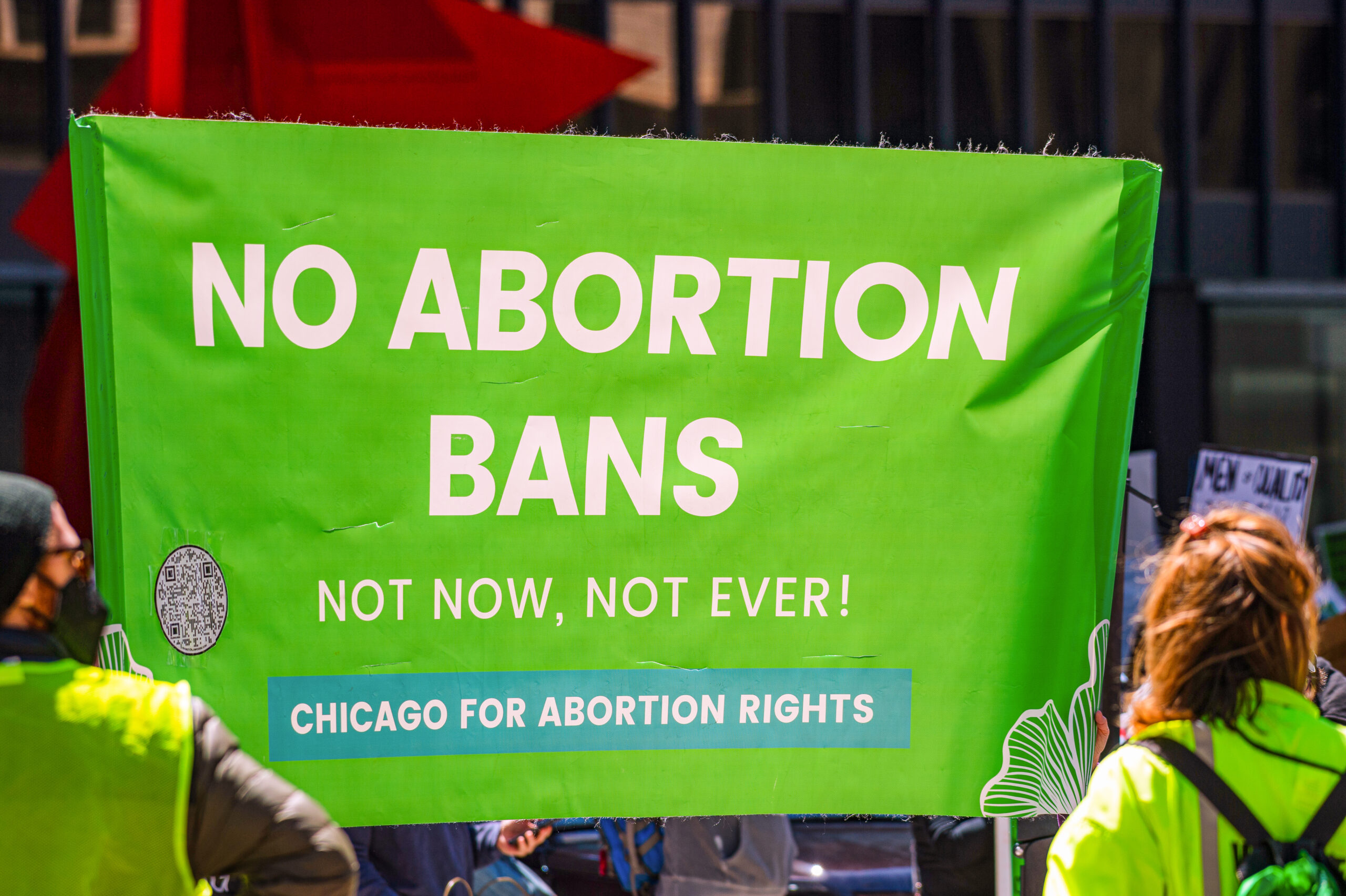 Lime-colored poster that reads No Abortion Bans