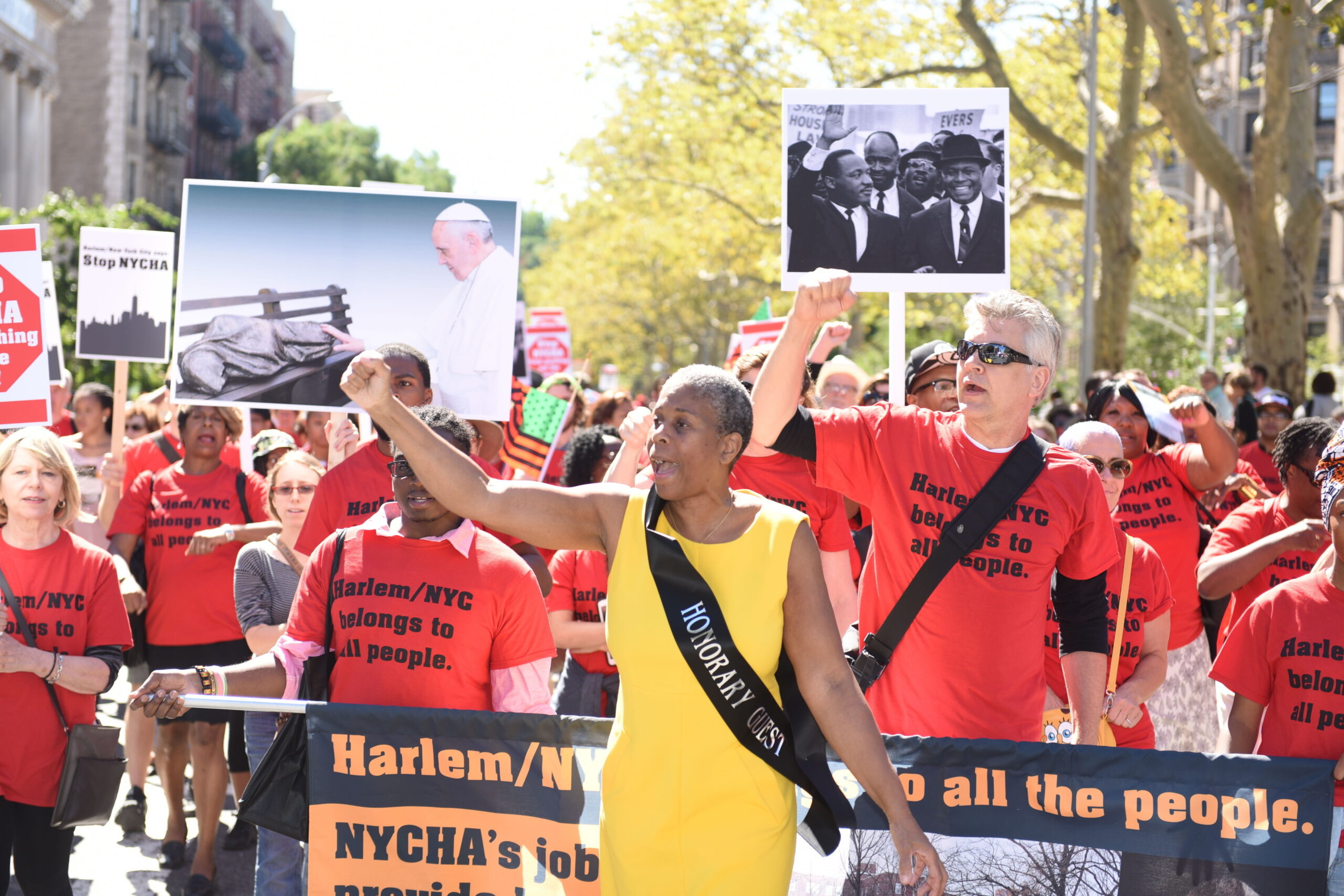 The 46th annual African-American Day Parade filled Adam Clayton Powell, Jr Blvd from 111th to 136th Sts. Dr Leonora Fulani with anti-gentrification activists